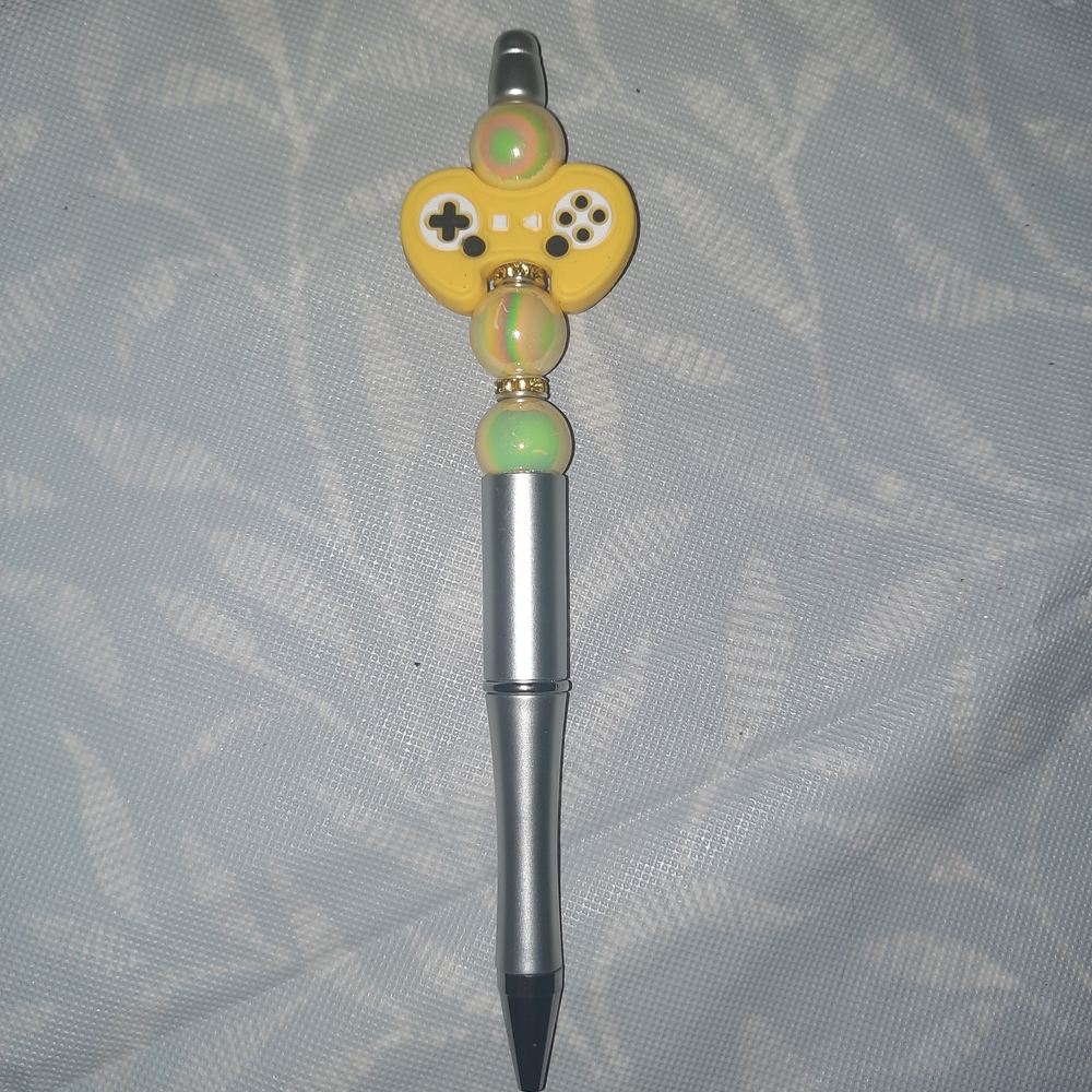 Silver and Yellow Gaming-Themed Pen
